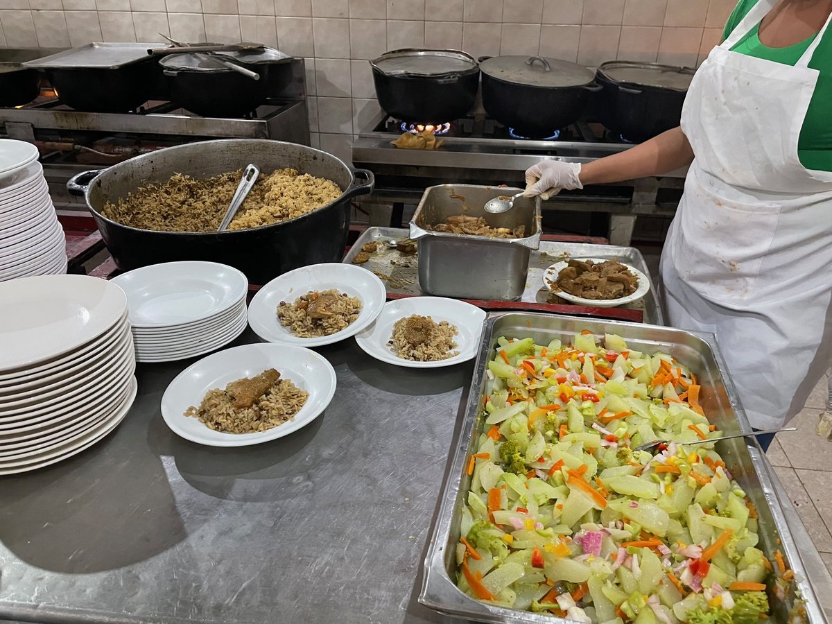 Plated meals and fresh salad prepared for students